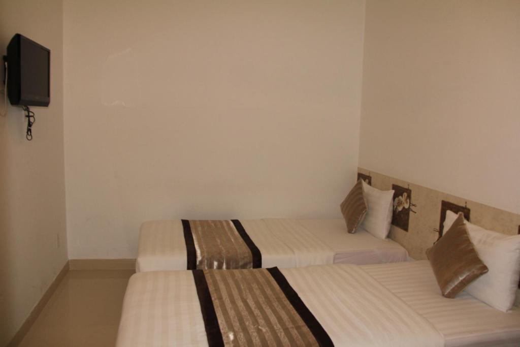 New Sunny Hotel Cidade de Ho Chi Minh Quarto foto